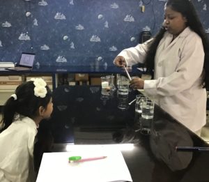 Performing science lab experiments to provide students with practical experience